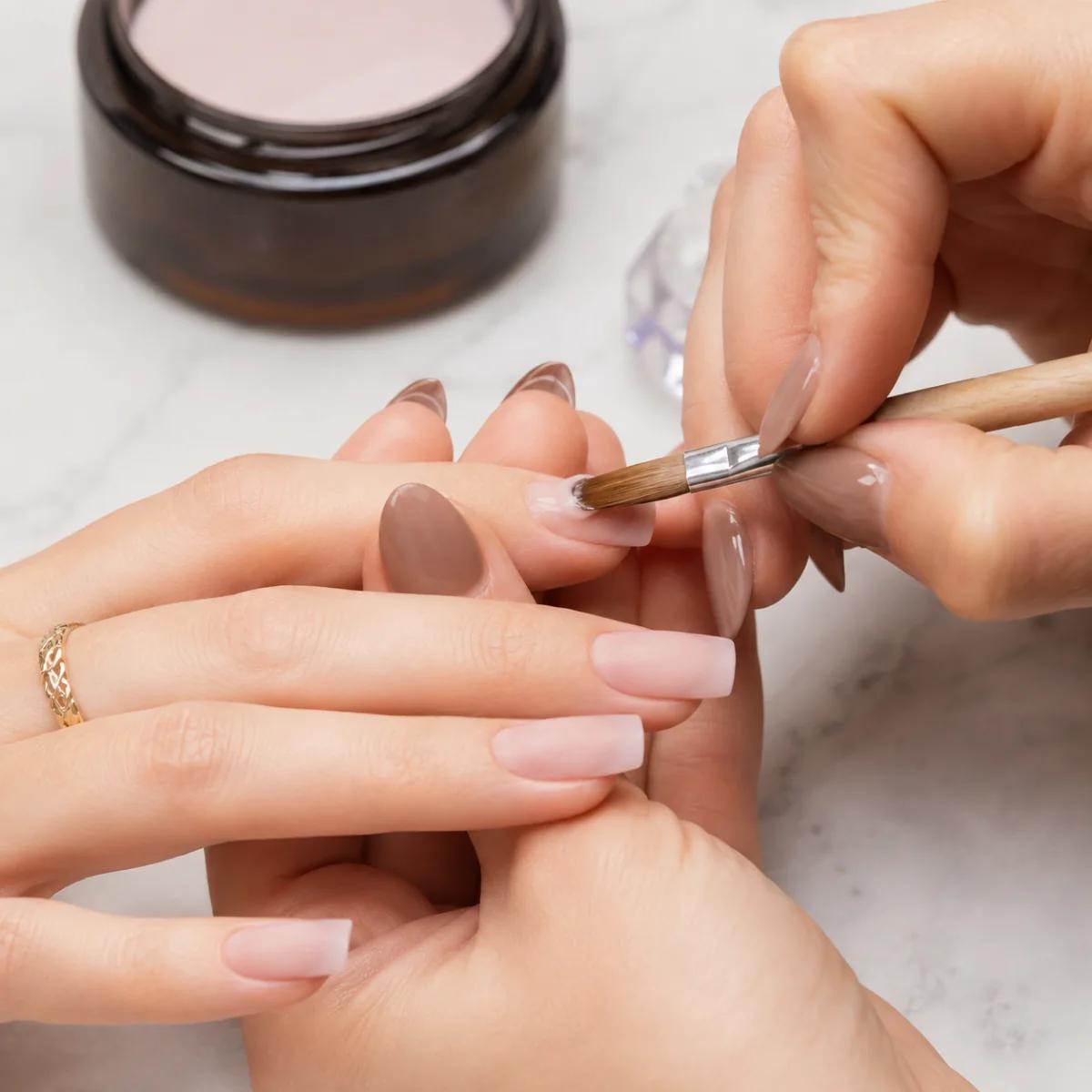 Almond acrylic nails in nude and mocha